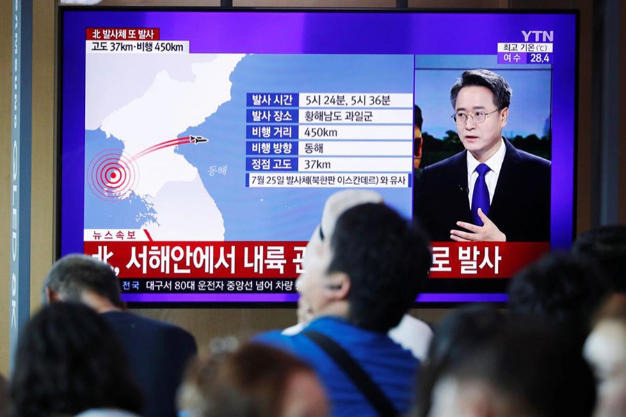 People watch a TV broadcasting a news report on North Korea firing two unidentified projectiles, in Seoul, South Korea on August 6, 2019 — Reuters photo