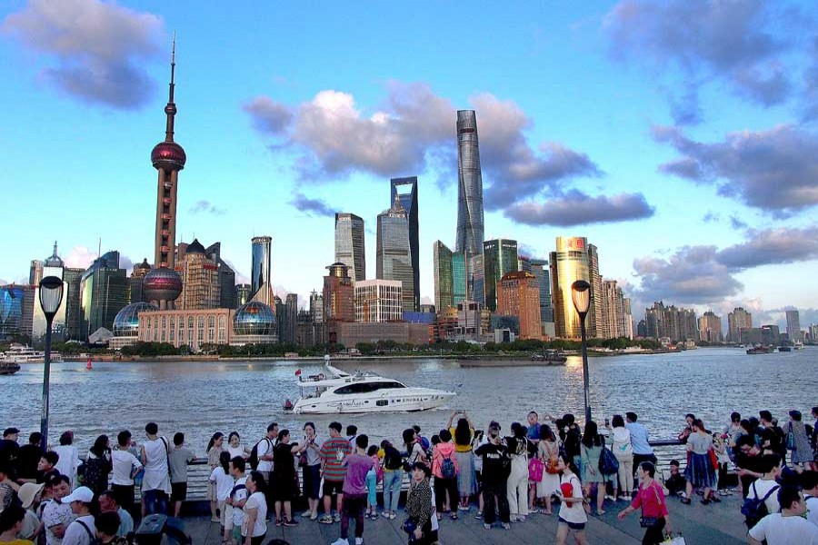 People visit the Bund in east China's Shanghai, Aug. 2, 2019. - Xinhua