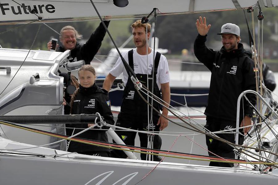 Greta Thunberg and crew's Pierre Casiraghi and Boris Herrmann waving from the Malizia II boat, in Plymouth, Britain, August 14. -Reuters photo
