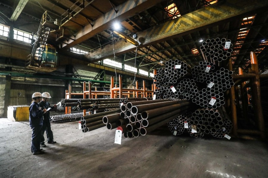 Workers inspect seamless steel tubes at a plant of Ansteel Group Co., Ltd. in Anshan, northeast China's Liaoning Province, July 5, 2019 - Xinhua/Pan Yulong
