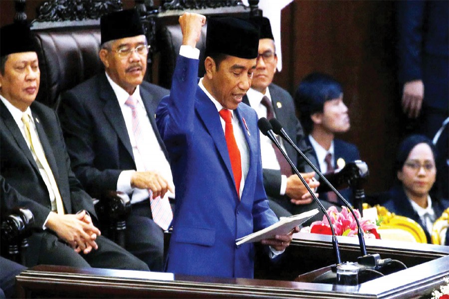 Indonesia President Joko Widodo delivers a speech in parliament in Jakarta on Friday: He formally proposed to parliament on Friday a plan to relocate Indonesia's capital from Jakarta to Kalimantan on the island of Borneo            —Photo:  Reuters   