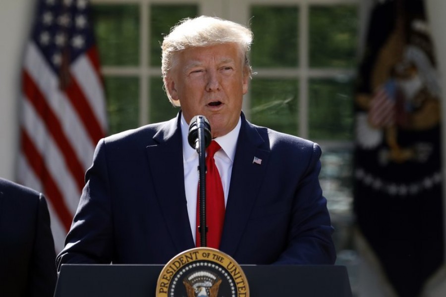 In this Aug. 29, 2019, file photo President Donald Trump speaks in the Rose Garden of the White House in Washington. The polarised politics of climate change and the Trump administration’s quest to scrap government regulations have forced companies into an inconvenient dilemma: Oppose deregulation that could boost profits or support it and risk a backlash from environmentally conscious consumers. (AP Photo/Carolyn Kaster, File)