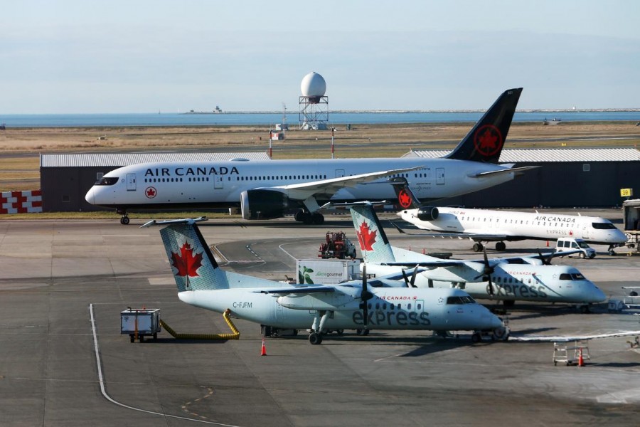 FILE PHOTO: Air Canada airplanes are pictured at Vancouver's international airport in Richmond, British Columbia, Canada, February 5, 2019. REUTERS/Ben Nelms