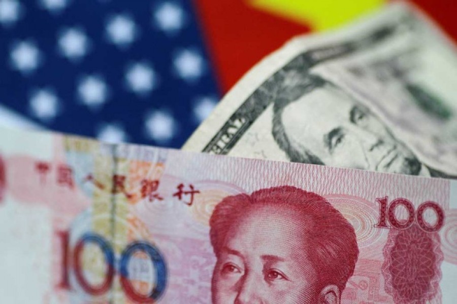 US dollar and China yuan notes are seen in this picture illustration June 2, 2017. Reuters/Files