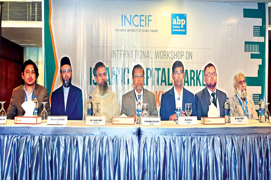 Former chairman of National Board of Revenue (NBR) Abdul Mazid (fourth from left) at the inaugural session of the workshop on "Islamic Capital Market and Sukuk" at a city hotel on Saturday -- FE photo