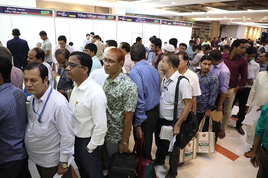 Taxpayers seen in the e-payment booths in one of the Income Tax Fair venues in Dhaka — FE/Files