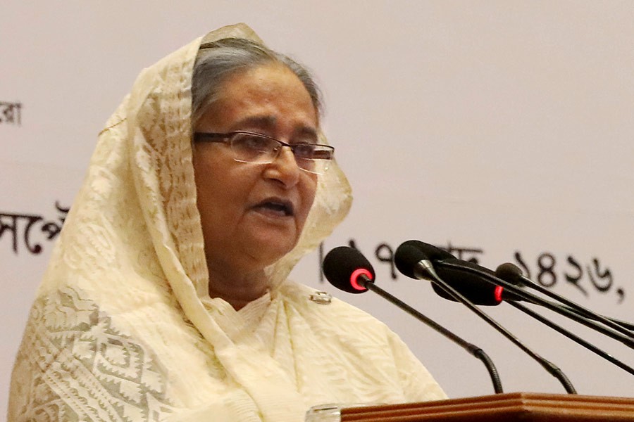 Prime Minister Sheikh Hasina addressing a function on awarding the prestigious National Export Trophy 2016-17 in the city on Sunday. -PID Photo