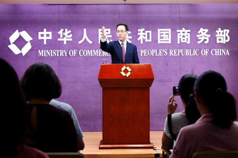 Gao Feng, spokesman for China's Ministry of Commerce (MOC), gestures at a press conference in Beijing, capital of China, September 5, 2019. Xinhua