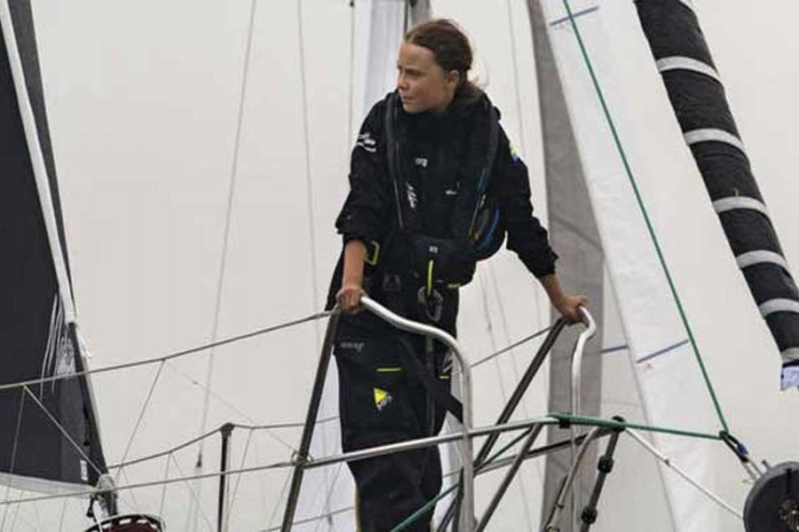 Greta Thunberg, 16-year-old climate activist from Sweden, sails into New York Harbor on August 28, 2019 flanked by a fleet of 17 sailboats representing each of the Sustainable Development Goals on their sails. She embarked on a trans-Atlantic voyage on August 14 from Plymouth, England to New York City on a solar-powered, zero-emission racing boat, the Malizia II, to attend the UN Climate Action Summit in New York September 23, one of six summit meetings scheduled to take place late September. 	—Photo credit: UN Photo/Mark Garten
