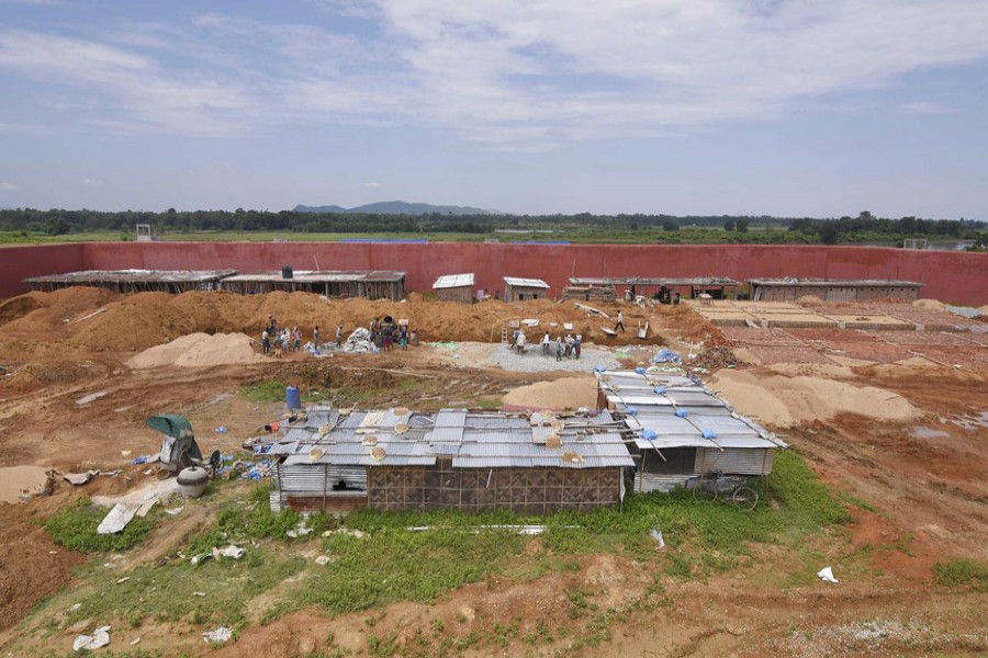 Labourers work at a construction site of a detention centre for illegal immigrants at a village in Goalpara district in the northeastern state of Assam, September 1, 2019. Reuters