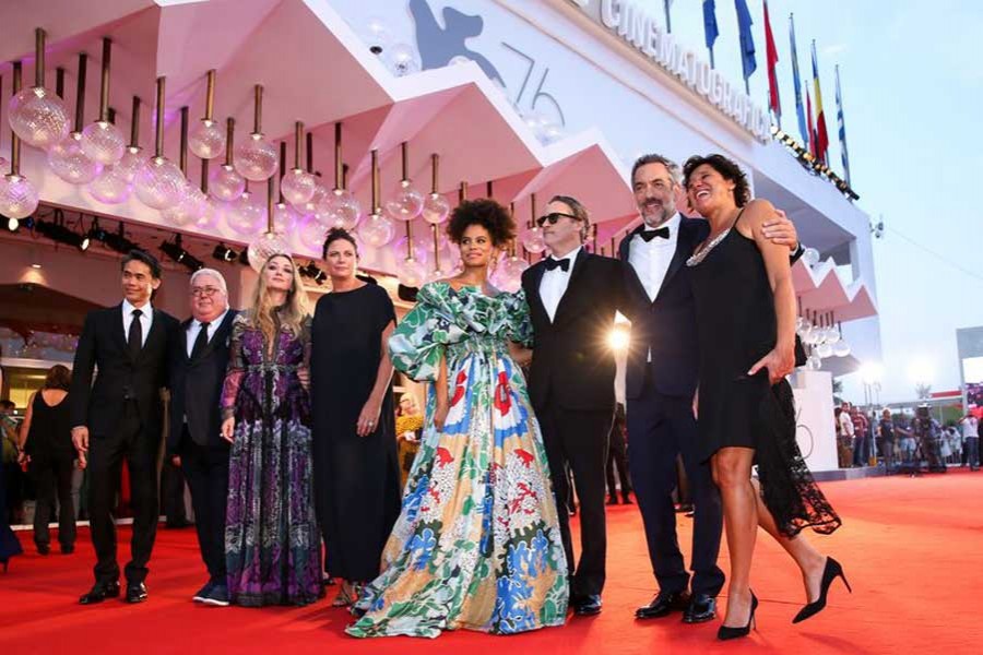 Director Todd Phillips (2nd R) and other cast members pose on the red carpet for the premiere of the film "Joker" during the 76th Venice International Film Festival in Venice, Italy, Aug. 31, 2019. (Xinhua/Zhang Cheng)