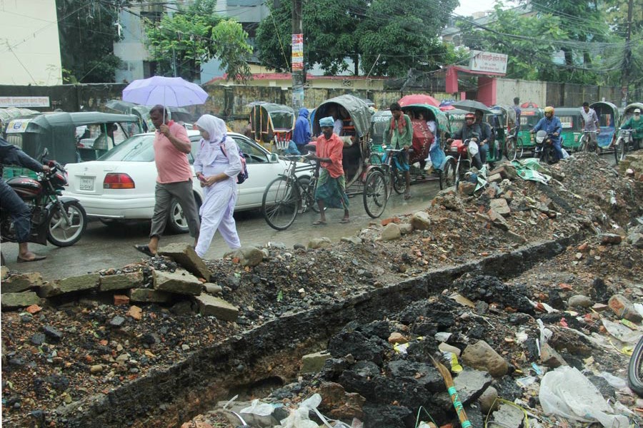 Pedestrians suffer much due to indiscriminate digging of roads for development work in the Sylhet City Corporation area	— FE Photo
