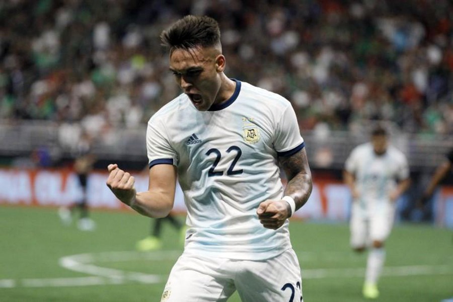 Argentina forward Lautaro Martínez celebrates after scoring a hat-trick against the Mexico at Alamadome — Soobum Im-USA TODAY Sports via REUTERS