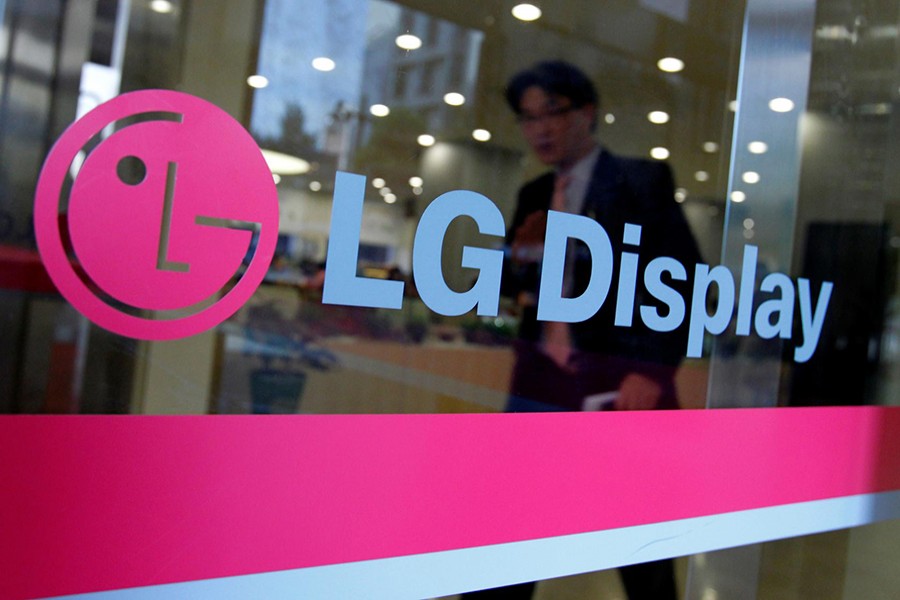 A man walks out of the headquarters of LG Display in Seoul on October 20, 2011 — Reuters/Files