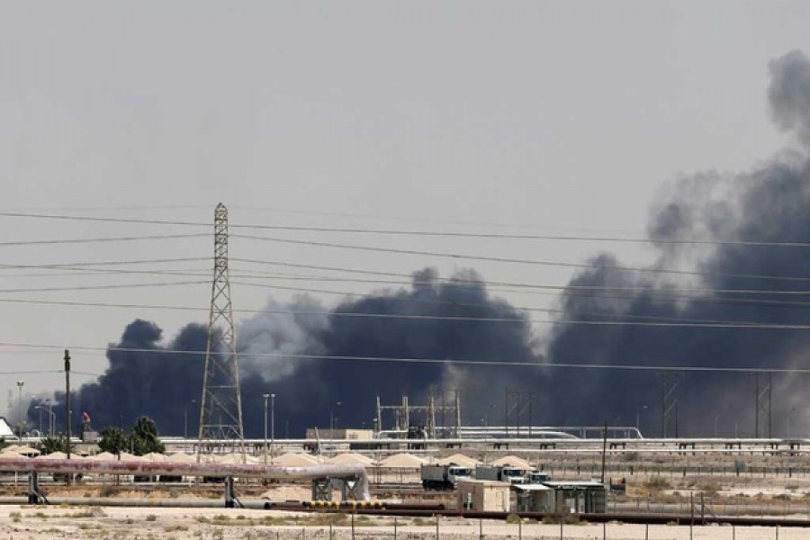 FILE PHOTO: Smoke is seen following a fire at Aramco facility in the eastern city of Abqaiq, Saudi Arabia, Sep 14, 2019. REUTERS
