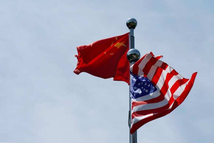 Chinese and US flags flutter near The Bund, before US trade delegation meet their Chinese counterparts for talks in Shanghai, China, July 30, 2019. Reuters/File Photo