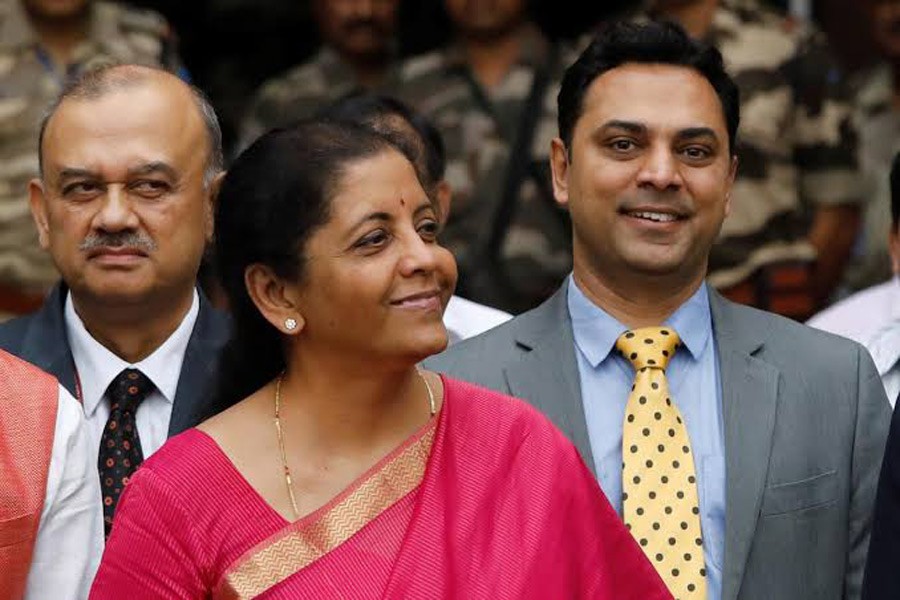 Finance Minister Nirmala Sitharaman (C) and Krishnamurthy Subramanian (R), chief economic adviser pose during a photo opportunity outside their office before the presentation of the federal budget in the parliament in New Delhi, India, July 5, 2019. Reuters/Files