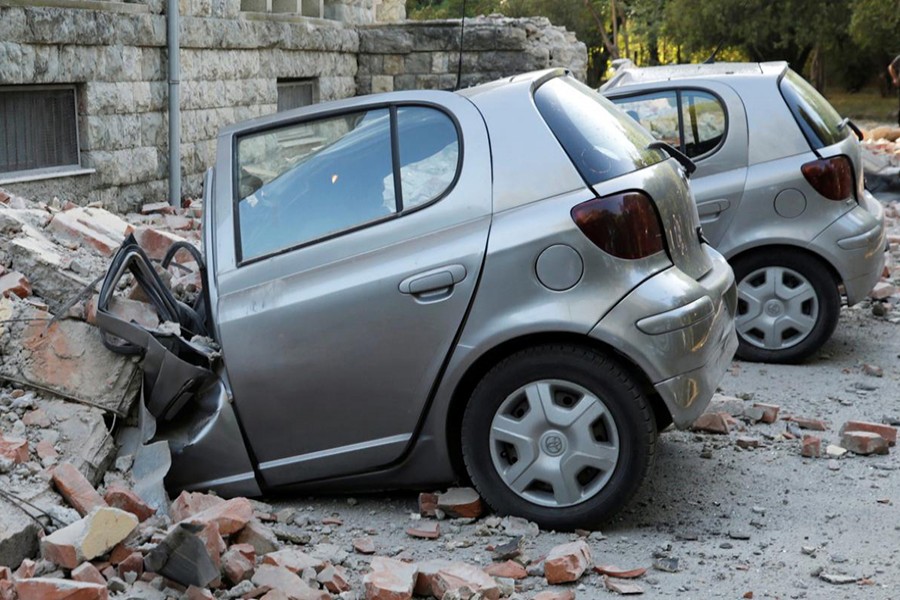 Destroyed cars stand next to a damaged building after an earthquake in Tirana, Albania on September 21, 2019 — Reuters photo