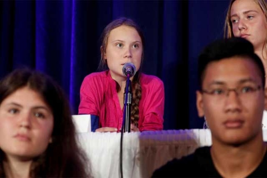 Swedish climate activist Greta Thunberg speaks with other child petitioners from twelve countries around the world who presented a landmark complaint to the United Nations Committee on the Rights of the Child to protest the lack of government action on the climate crisis during a press conference in New York, US, September 23, 2019. Reuters