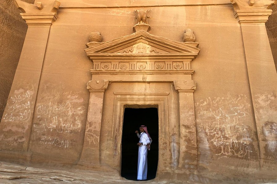 A Saudi tour guide stands inside a tomb at Madain Saleh antiquities site, al-Ula, Saudi Arabia on February 10, 2019 — Reuters/Files