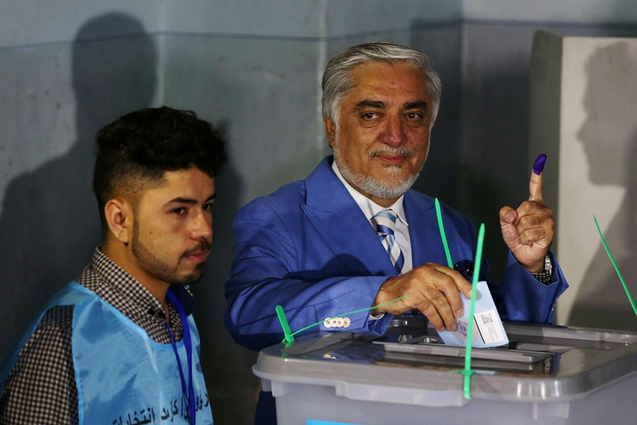 Afghan presidential candidate Abdullah Abdullah posing as he casts his vote at a polling station in Kabul, Afghanistan on Saturday. -Reuters Photo