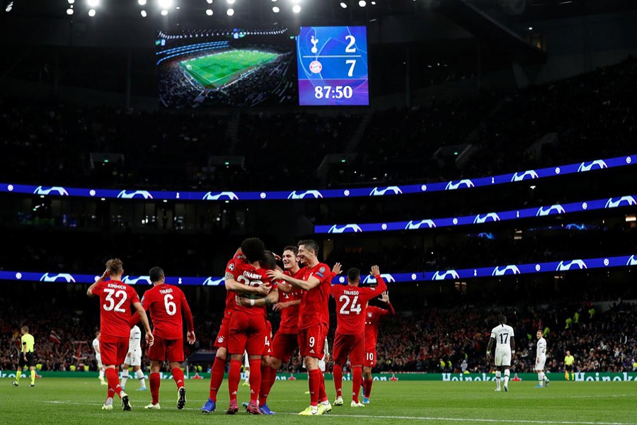 Bayern Munich's Serge Gnabry celebrates scoring their seventh goal with teammates — Reuters action image