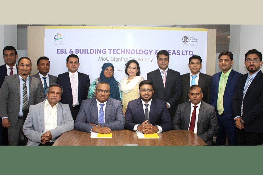 M Khorshed Anowar, head of Retail and SME Banking of EBL (second from left seated) and Mahmudul Kabir, executive director - Sales & Marketing of bti (second from right seated), with other officials from both the organisations, pose for a photograph after signing the deal on home loan recently