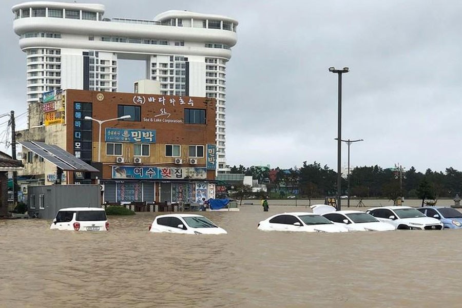 Cars are submerged in floodwater after Typhoon Mitag brought heavy rain and flood to Gangneung, South Korea, October 3, 2019, in this photo obtained from social media. @DIBIDIBOB/via REUTERS