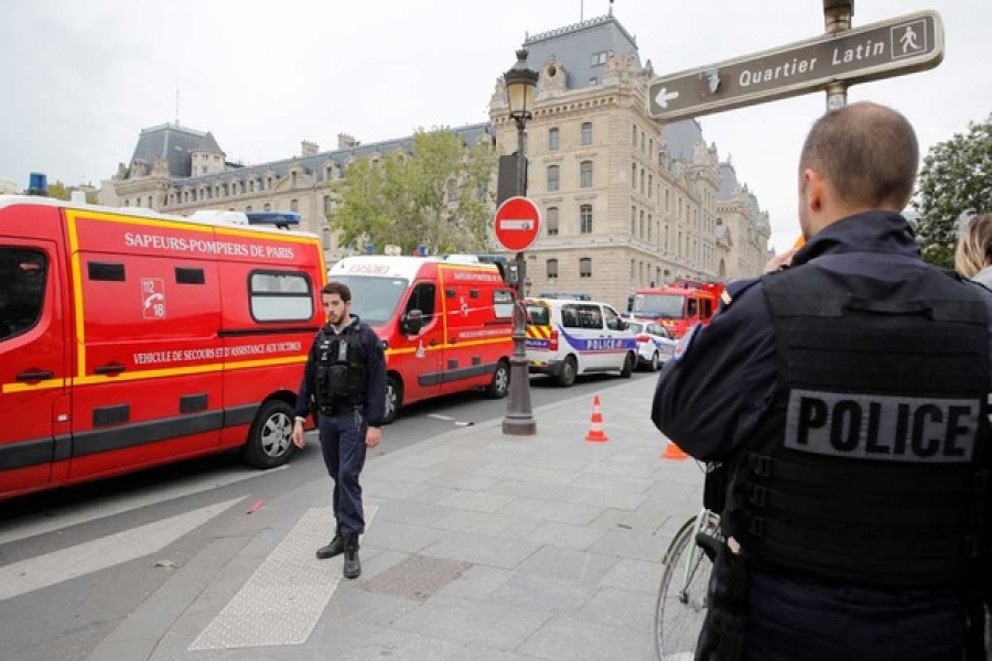 Knife attack by employee at Paris police HQ kills four officers