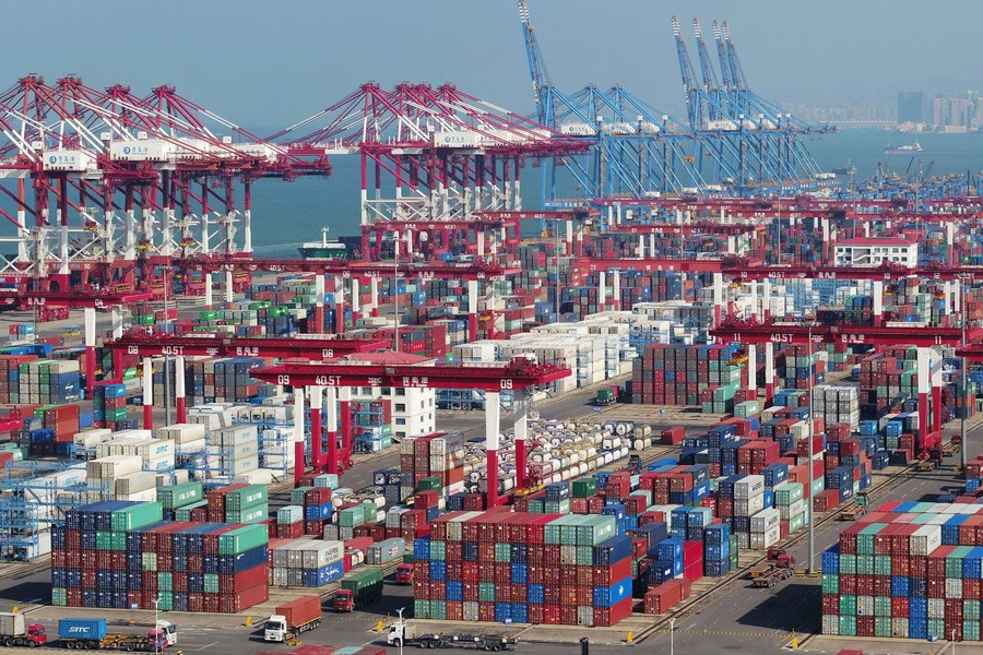 Containers and trucks are seen at a terminal of the Qingdao port in Shandong province, China, November 8, 2018. Reuters/Files