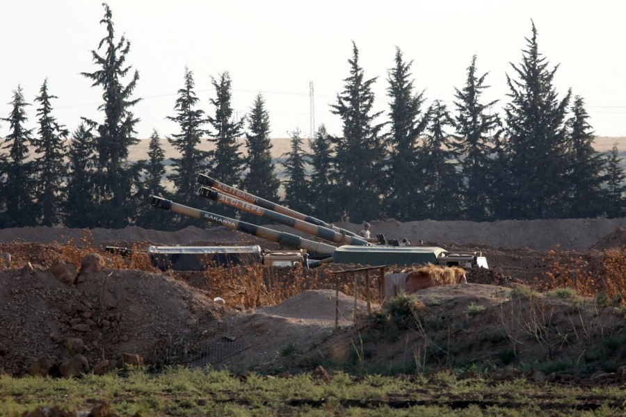 FILE PHOTO: Turkish army howitzers are positioned on the Turkish-Syrian border, near the southeastern town of Akcakale in Sanliurfa province, Turkey, October 7, 2019. REUTERS/Stringer