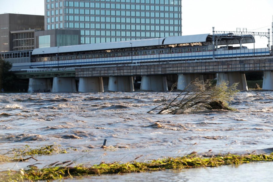 At least 25 people died in Fukushima, including a mother and child who were caught in flood waters - Reuters photo