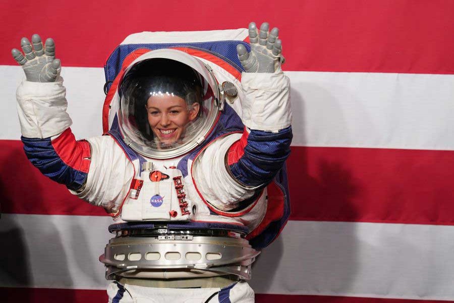 Advanced Space Suit Engineer Kristine Davis displays the Exploration Extravehicular Mobility Unit (xEMU) spacesuit at NASA headquarters in Washington DC, the United States, on Oct. 15, 2019. (Xinhua/Liu Jie)