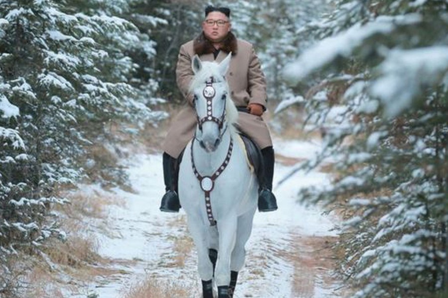 N Korean leader Kim Jong-un riding a white horse on a snow-covered Mount Paektu  	— Reuters