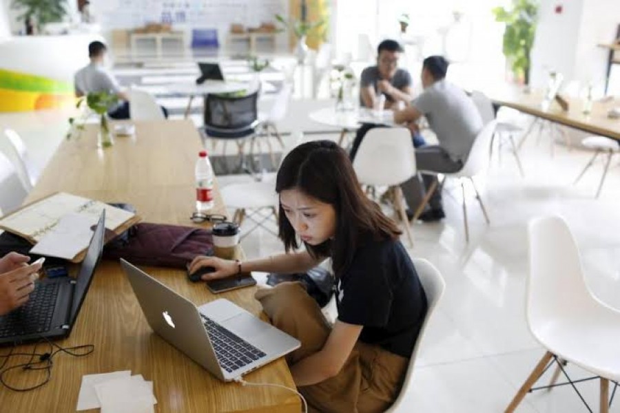 Young entrepreneurs look at their computers at a resting area inside the University Students Venture Park, in Shanghai, China, July 29, 2015. REUTERS/Aly Song