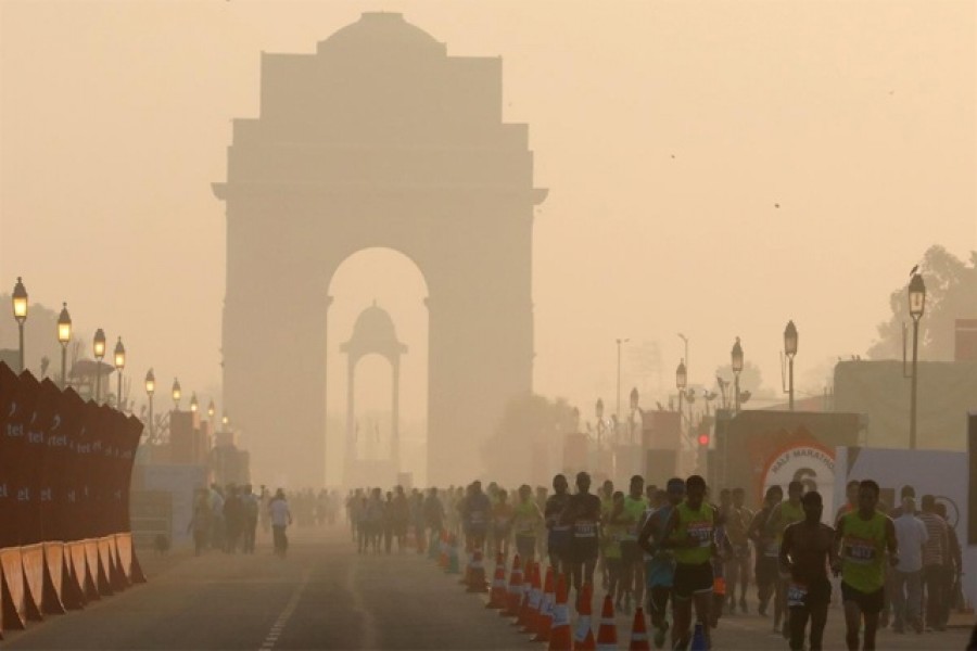 Participants run past the India Gate as they take part in the Airtel Delhi Half Marathon in New Delhi, India, Oct 20, 2019. REUTERS