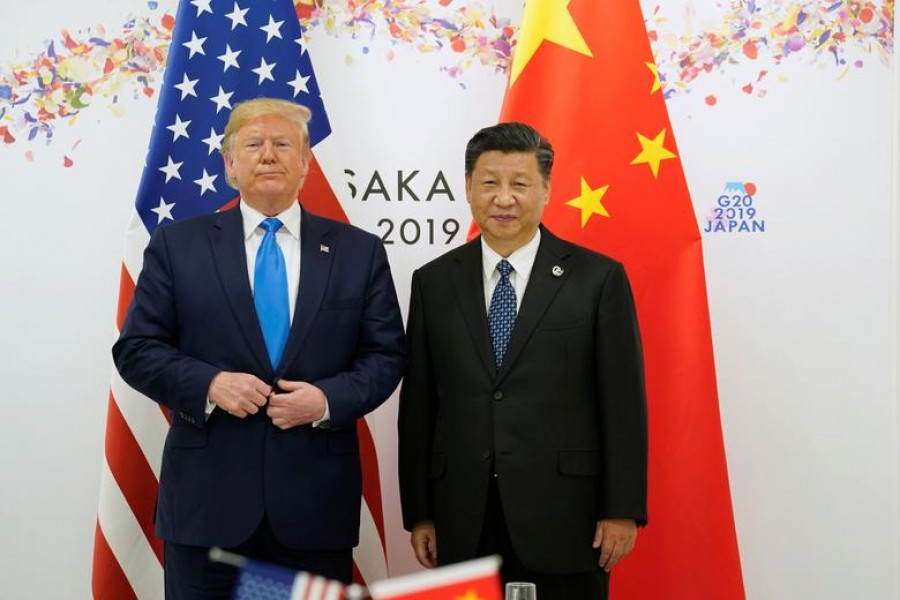 US president Donald Trump poses for a photo with China's president Xi Jinping before their bilateral meeting during the G20 leaders summit in Osaka, Japan, June 29, 2019. Reuters/Files