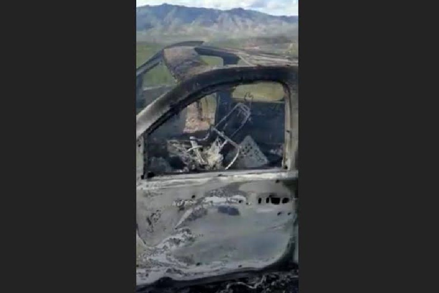 The burnt wreckage of a vehicle transporting a Mormon family living near the border with the U.S. is seen, after the family was caught in a crossfire between unknown gunmen from rival cartels, in Bavispe, Sonora, Mexico November 4, 2019, in this picture obtained from social media. Mandatory credit KENNETH MILLER/LAFE LANGFORD JR/via REUTERS