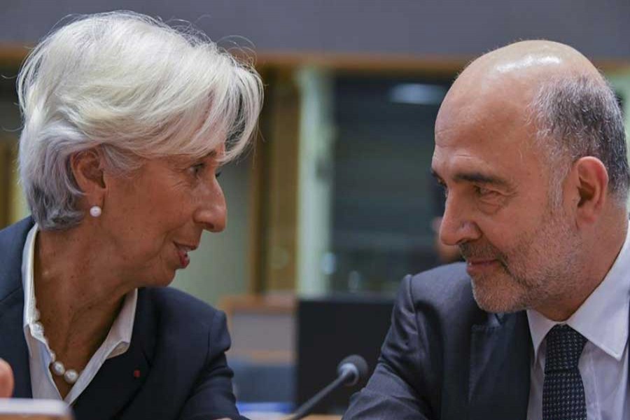 Christine Lagarde (L), President of the European Central Bank, talks with European Commissioner for Economic and Financial Affairs, Taxation and Customs Pierre Moscovici before the Eurogroup meeting in Brussels, Belgium, on Nov. 7, 2019. The European Commission said on Thursday that euro area gross domestic product (GDP) is forecast to expand by 1.1 per cent in 2019 and by 1.2 per cent in 2020 and 2021. Compared with the projections the European Union's executive arm published in July, the growth forecast has been downgraded by 0.1 percentage points for 2019 and 0.2 percentage points for 2020. (Photo by Riccardo Pareggiani/Xinhua)