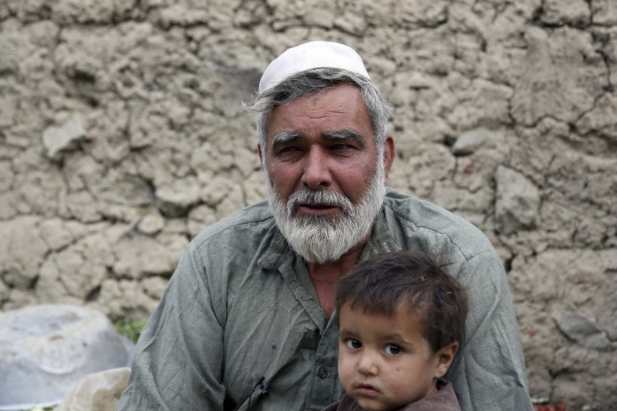 In this Oct. 29, 2019 photo, Yusouf, who escaped war in eastern Afghanistan to safeguard his family, speaks during an interview in Kabul, Afghanistan. In the capital, Kabul, five of his children died, not from violence or bombings, but from air pollution, worsened by bitter cold and poverty. (AP Photo/Rahmat Gul)