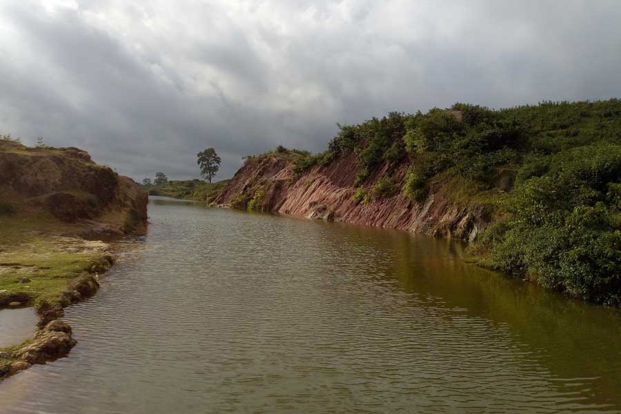 The Someswari river runs quietly  	— FE Photo