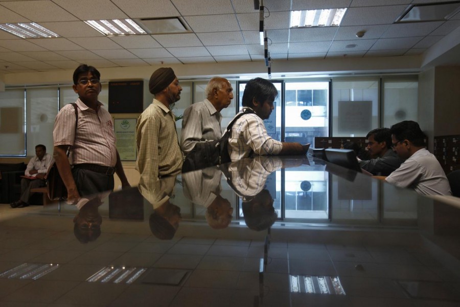 People line to submit their papers inside the Income Tax office in New Delhi, April 5, 2013. Reuters/Files