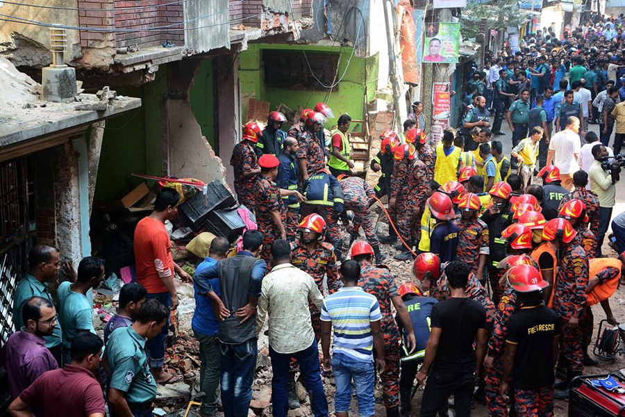 Firefighters work at the site of an explosion which occurred at a house in Chattogram’s Patharghata area on Sunday morning — Reuters photo