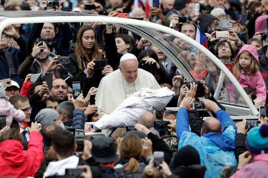 Pope Francis is given a newborn baby to bless as he arrives for his weekly general audience in St. Peter's Square, at the Vatican, Wednesday, Nov. 13, 2019. -AP Photo
