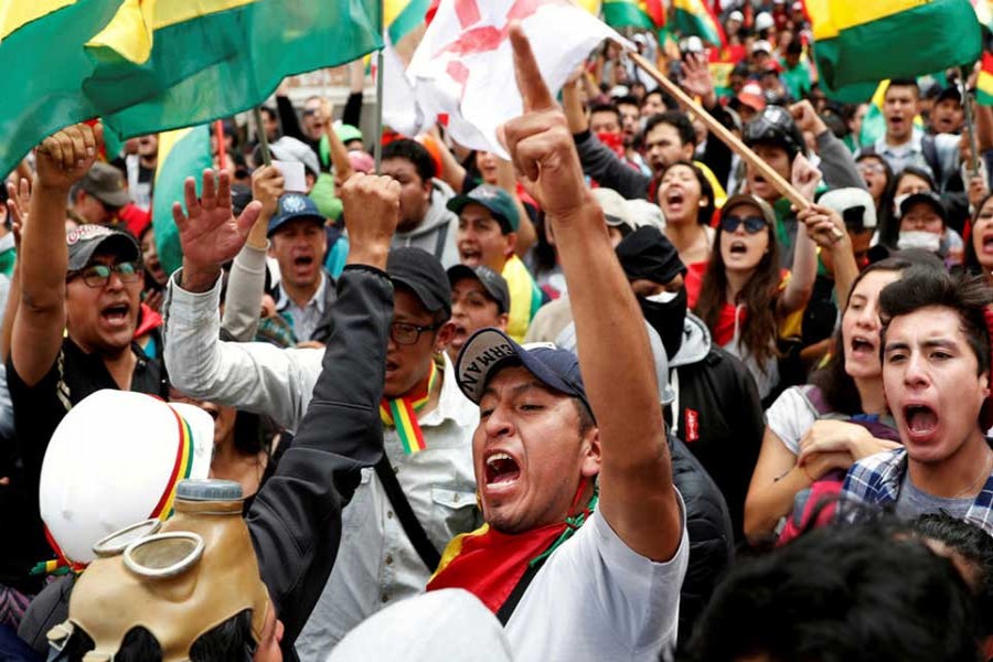 People shout slogans during a protest against Bolivia's President Evo Morales in La Paz, Bolivia on November 09, 2019. 	— Photo: Reuters