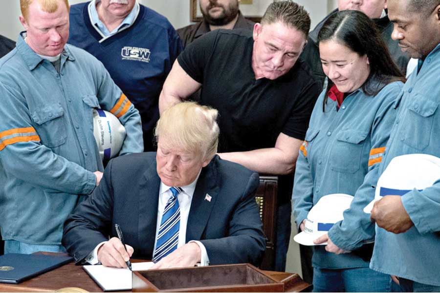 President Donald Trump signs the proclamation on steel imports on March 08, 2018.          —Photo: AP   