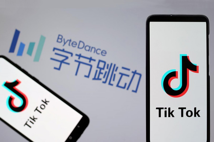 Tik Tok logos are seen on smartphones in front of a displayed ByteDance logo in this illustration taken on November 27, 2019 — Rueters Illustration