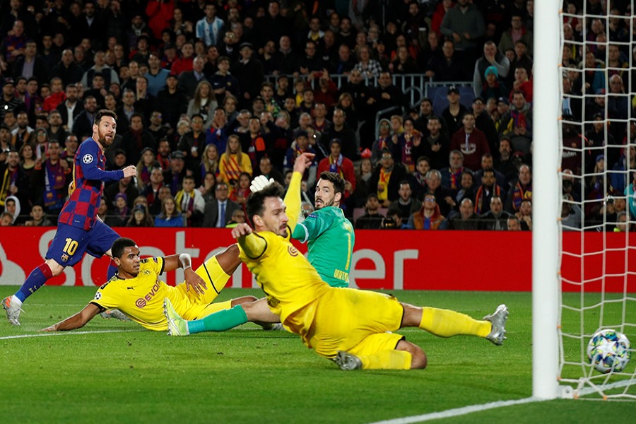 Barcelona's Lionel Messi scores their second goal against Borussia Dortmund — Reuters photo