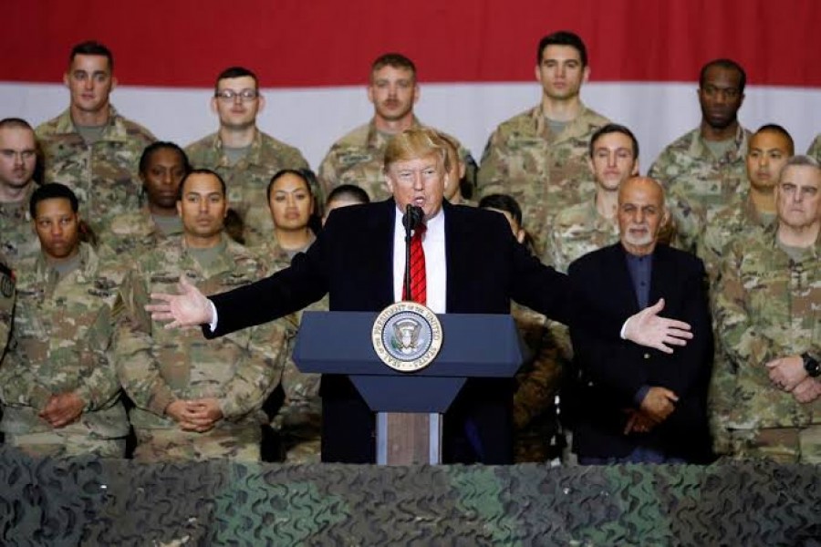 US President Donald Trump delivers remarks to U.S. troops in an unannounced visit to Bagram Air Base, Afghanistan, November 28, 2019. REUTERS/Tom Brenner RARE WAR ZONE VISIT