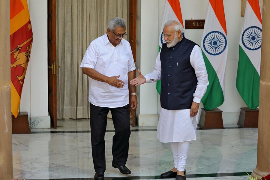 Sri Lanka's President Gotabaya Rajapaksa and India's Prime Minister Narendra Modi shaking their hands during a photo opportunity ahead of their meeting at Hyderabad House in New Delhi, India on Friday. -Reuters Photo